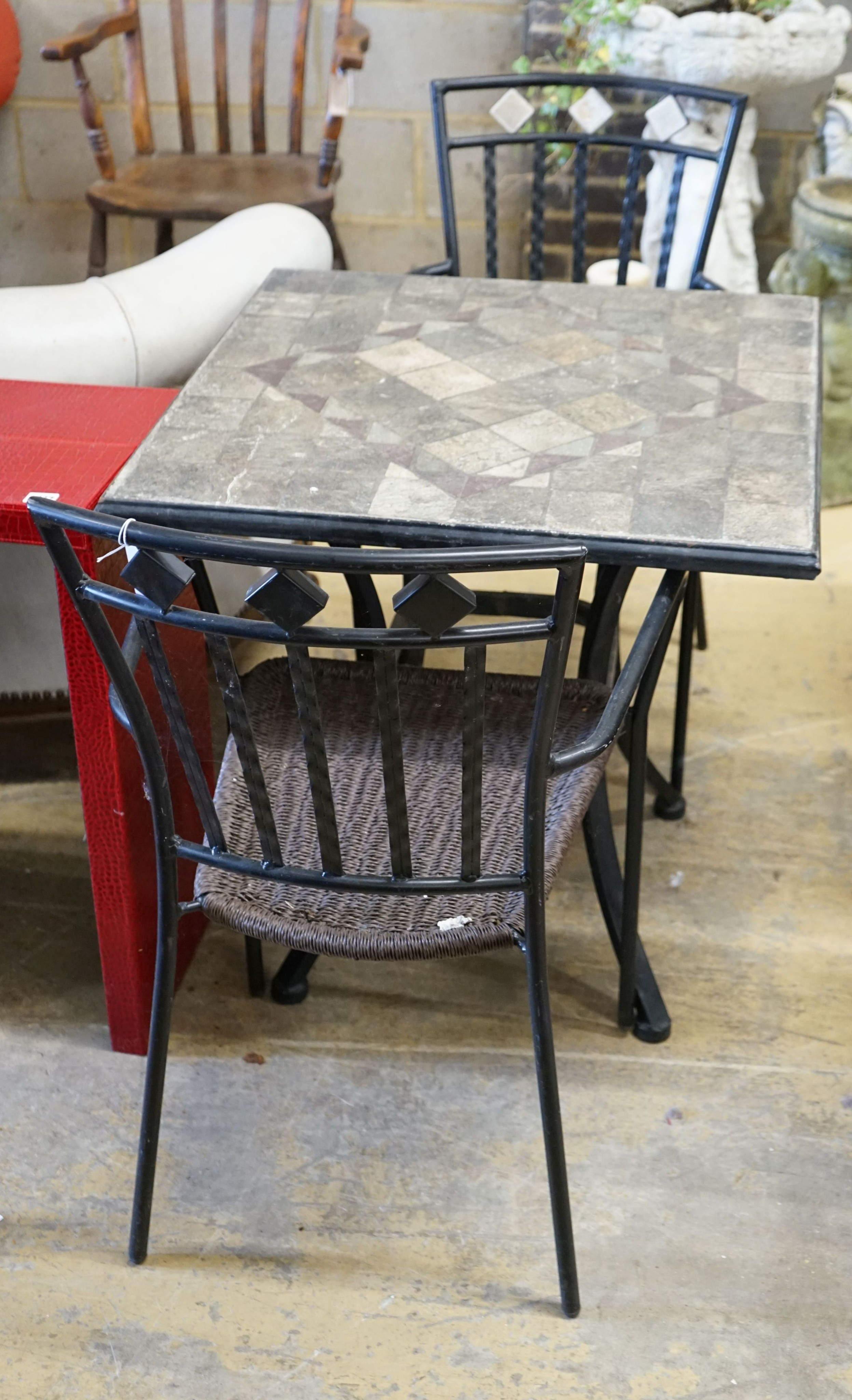 A square mosaic stone topped garden table, width 70cm, height 72cm and two matching chairs